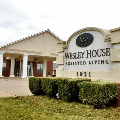 Wesley House Assisted Living sign in front of building